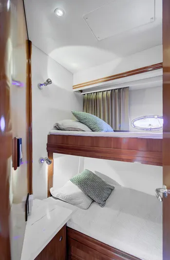 No Surrender Yacht Photos Pics Bunk beds in 2000 Carver 530 Voyager Pilothouse cabin with modern decor and lighting.