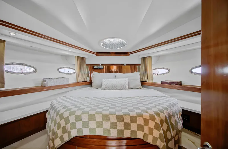 No Surrender Yacht Photos Pics Luxurious bedroom interior of 2000 Carver 530 Voyager Pilothouse yacht with elegant bedding.