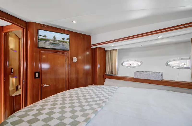 No Surrender Yacht Photos Pics Luxurious cabin interior of 2000 Carver 530 Voyager Pilothouse yacht with wood paneling.