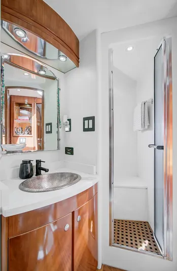 No Surrender Yacht Photos Pics Luxurious bathroom in 2000 Carver 530 Voyager Pilothouse with modern fixtures and shower.