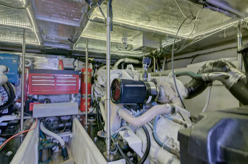 No Surrender Yacht Photos Pics Engine room of 2000 Carver 530 Voyager Pilothouse with visible machinery and equipment.