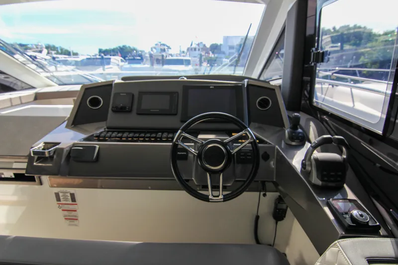  Yacht Photos Pics Helm of 2021 Galeon 425 HTS yacht with modern controls and navigation systems.