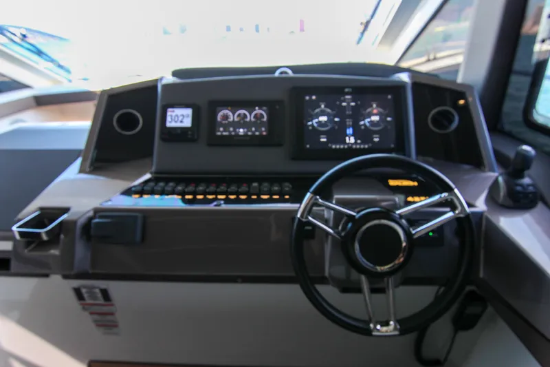  Yacht Photos Pics Helm of 2021 Galeon 425 HTS yacht with modern navigation displays and controls.