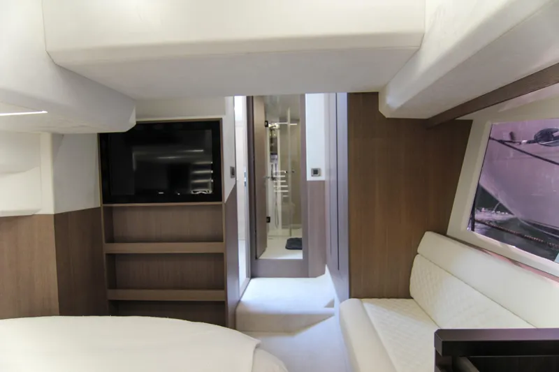  Yacht Photos Pics Luxurious interior of 2021 Galeon 425 HTS yacht with modern furnishings and a TV.