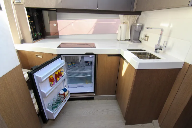  Yacht Photos Pics Modern kitchen in 2021 Galeon 425 HTS yacht with open fridge and sleek design.