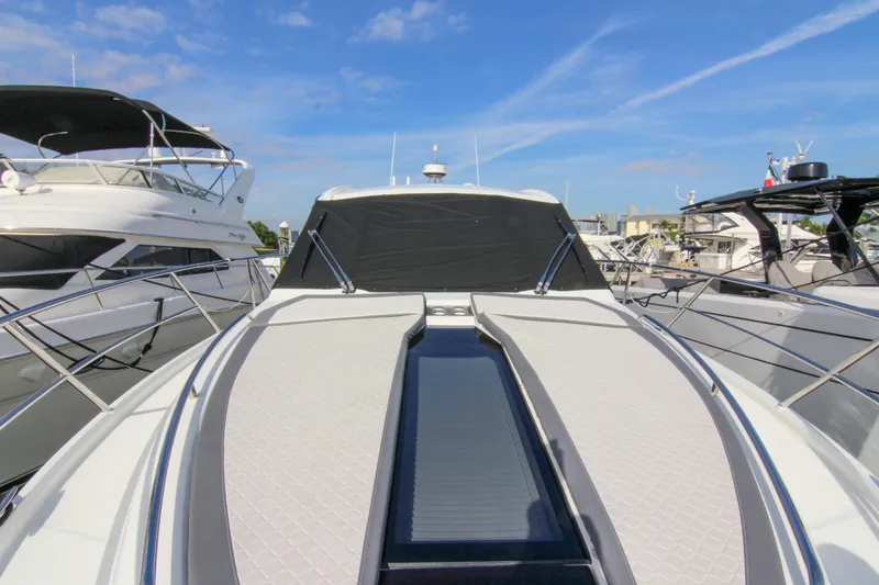  Yacht Photos Pics 2021 Galeon 425 HTS yacht docked, showcasing sleek design and modern features under a clear sky.
