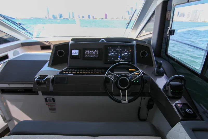  Yacht Photos Pics Cockpit of 2021 Galeon 425 HTS yacht with modern navigation controls and sea view.
