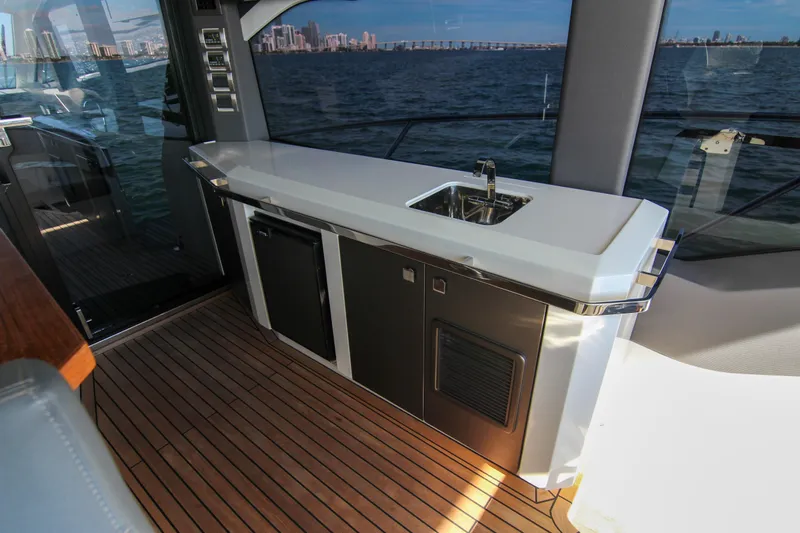  Yacht Photos Pics Luxury Galeon 425 HTS 2021 yacht interior with sleek kitchenette and ocean view.