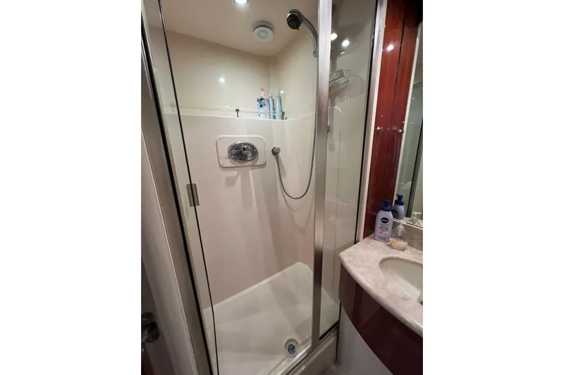  Yacht Photos Pics Shower area in 2007 Lazzara 68 yacht, featuring glass door and modern fixtures.