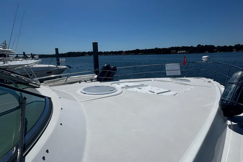  Yacht Photos Pics 2008 Cruisers 420 yacht docked by the water on a sunny day.