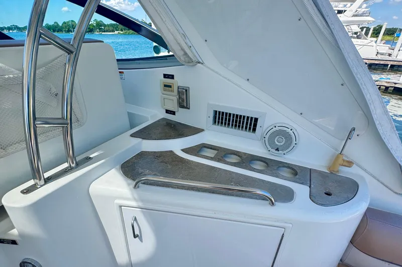  Yacht Photos Pics 2008 Cruisers 420 yacht interior with kitchenette and stainless steel accents.