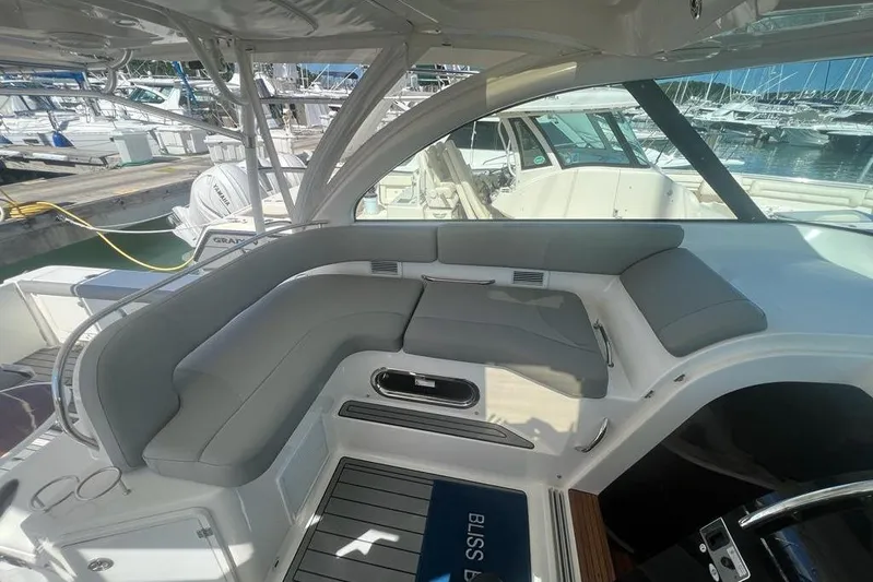  Yacht Photos Pics 2018 Pursuit OS 385 Offshore boat interior with gray seating at marina.