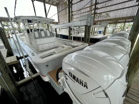  Yacht Photos Pics 2020 Regulator 41 boat with Yamaha engines docked in a covered marina.