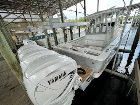  Yacht Photos Pics 2020 Regulator 41 boat with Yamaha engines docked in a covered marina.