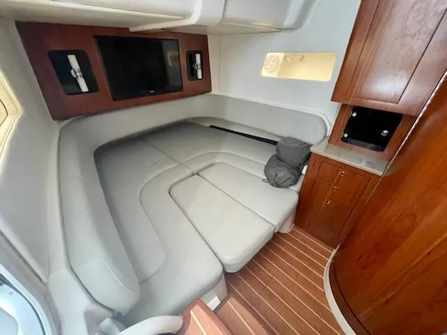  Yacht Photos Pics Luxurious interior cabin of 2020 Regulator 41 boat with leather seating and wooden cabinetry.