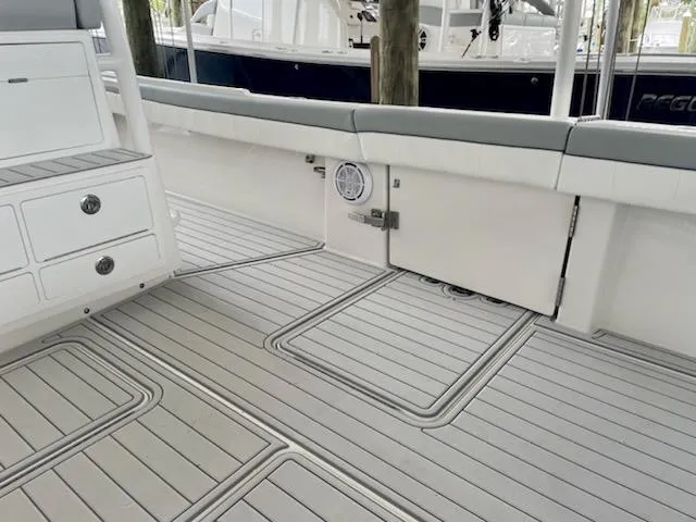  Yacht Photos Pics 2020 Regulator 41 boat interior with cushioned seating and storage compartments.