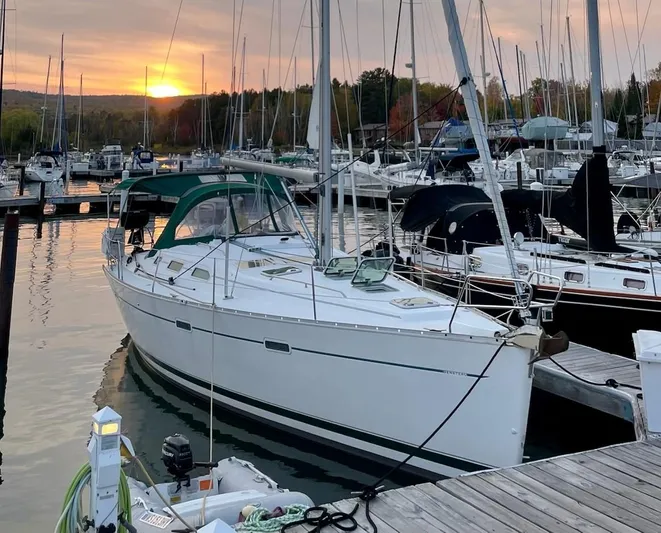 Oasis Yacht Photos Pics Sailboat Beneteau Oceanis 393, 2004 model, docked at marina during sunset.