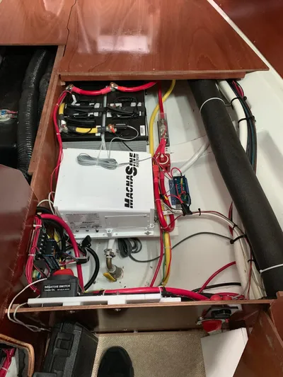 Oasis Yacht Photos Pics Electrical system inside a 2004 Beneteau Oceanis 393 sailboat, featuring wiring and components.