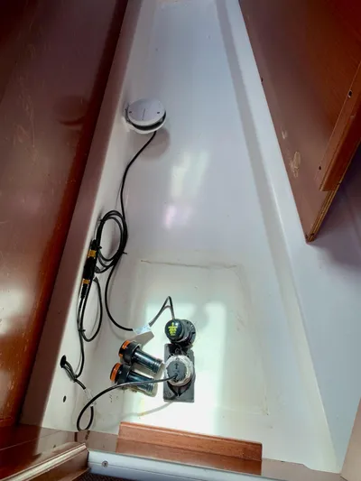 Oasis Yacht Photos Pics Beneteau Oceanis 393 (2004) interior compartment with wiring and equipment.