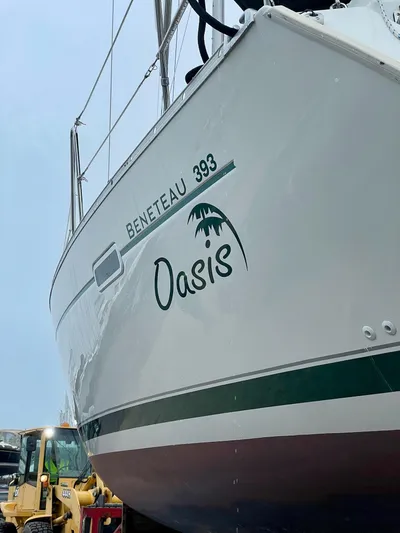 Oasis Yacht Photos Pics 2004 Beneteau Oceanis 393 sailboat named Oasis, docked with visible hull design.