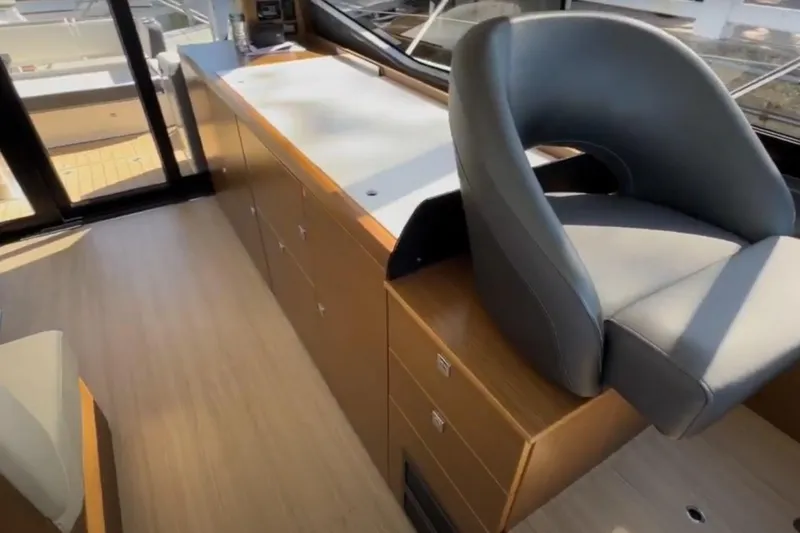 #boatshowspecial Yacht Photos Pics Interior of 2023 Bavaria R40 Coupe yacht with modern seating and cabinetry.