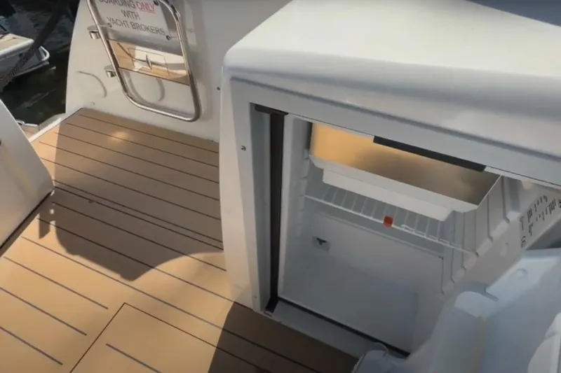 #boatshowspecial Yacht Photos Pics 2023 Bavaria R40 Coupe yacht deck with open fridge, showcasing modern design.