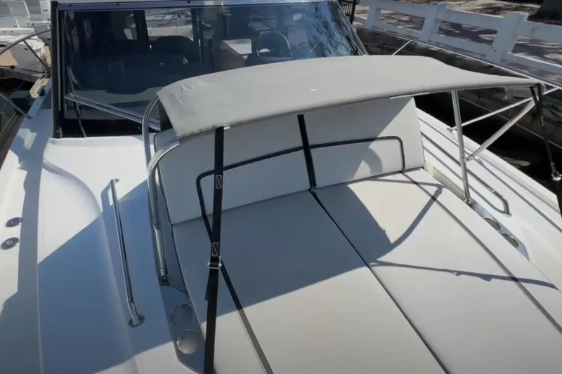 #boatshowspecial Yacht Photos Pics 2023 Bavaria R40 Coupe boat with sunshade and sleek deck design.