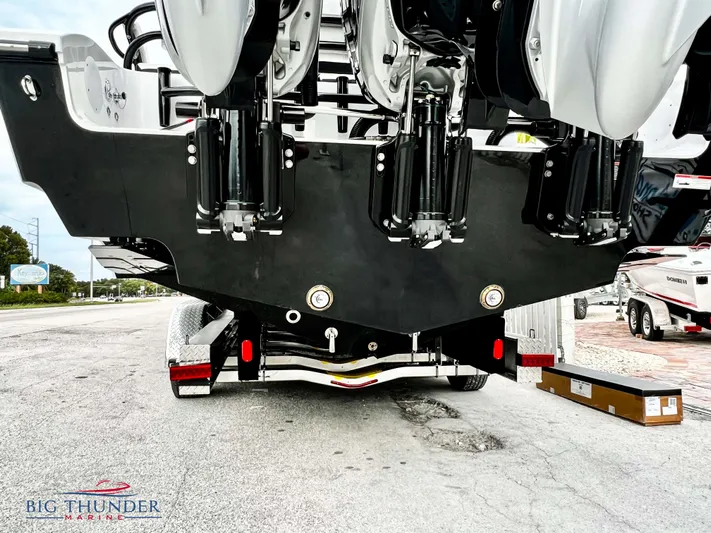  Yacht Photos Pics 2023 Fountain 38 TE boat rear view with triple outboard engines.