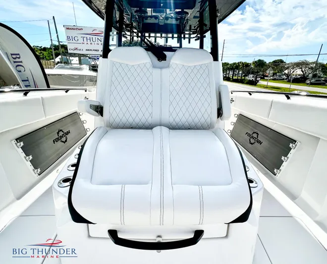  Yacht Photos Pics 2023 Fountain 38 TE boat interior with white cushioned seating.