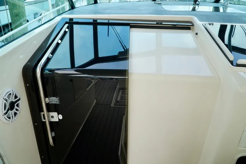 Survey Cruise Yacht Photos Pics 1998 Tiara Yachts 4000 Express cabin entrance with sliding door and sleek design.