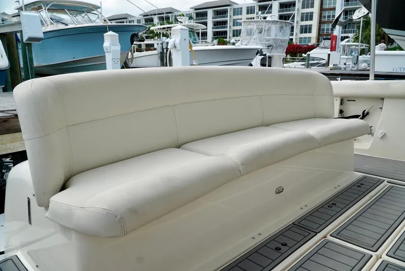 Survey Cruise Yacht Photos Pics 1998 Tiara Yachts 4000 Express boat with white leather seating at a marina.
