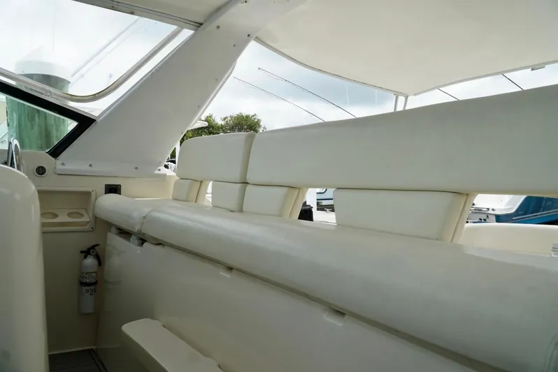 Survey Cruise Yacht Photos Pics 1998 Tiara Yachts 4000 Express interior with white seating and sleek design.