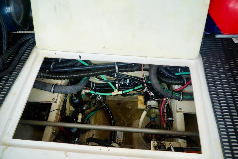 Survey Cruise Yacht Photos Pics Engine compartment of a 1998 Tiara Yachts 4000 Express, showing wiring and hoses.