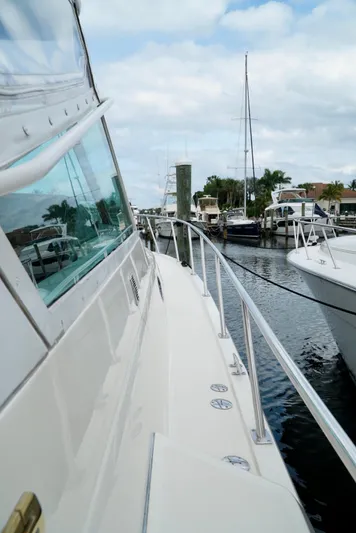 Survey Cruise Yacht Photos Pics 1998 Tiara Yachts 4000 Express docked, showcasing sleek design and marina view.