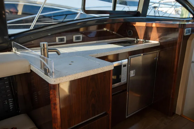 Logan Yacht Photos Pics Luxurious 2018 Sea Ray Sundancer 400 yacht interior kitchen with modern appliances and sleek design.