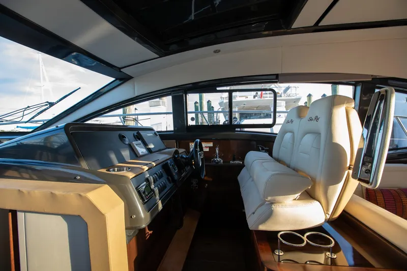 Logan Yacht Photos Pics 2018 Sea Ray Sundancer 400 helm with luxurious seating and modern controls.