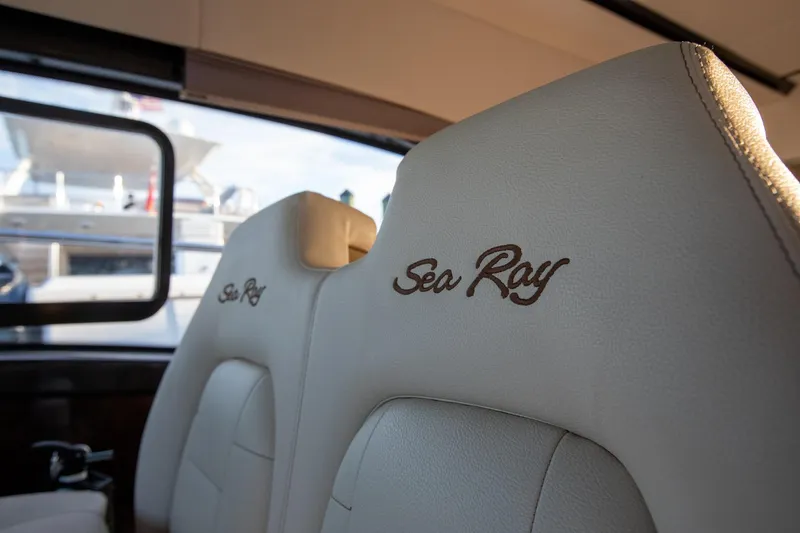 Logan Yacht Photos Pics Luxurious interior seating of 2018 Sea Ray Sundancer 400 yacht, featuring elegant embroidery.