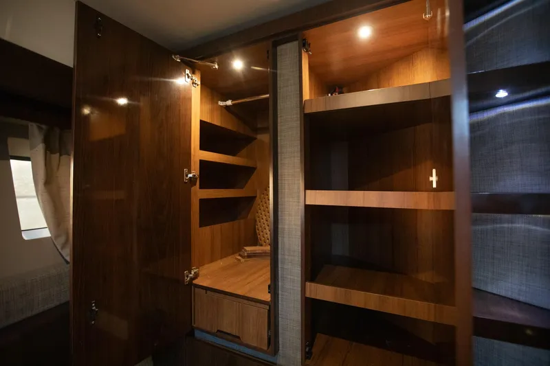 Logan Yacht Photos Pics Luxurious wooden cabinetry inside 2018 Sea Ray Sundancer 400 yacht, featuring ample storage space.