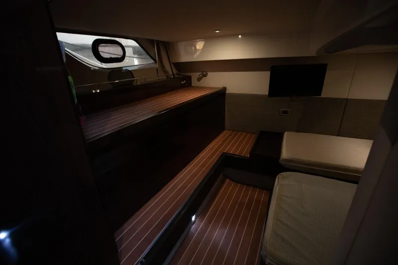 Logan Yacht Photos Pics Interior of 2018 Sea Ray Sundancer 400 yacht with wooden flooring and cozy seating.