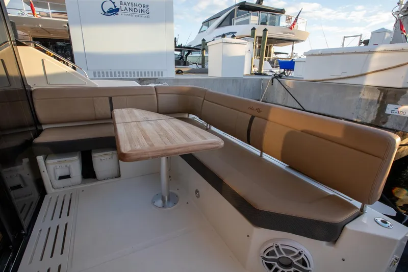 Logan Yacht Photos Pics 2018 Sea Ray Sundancer 400 yacht with outdoor seating and wooden table at Bayshore Landing.