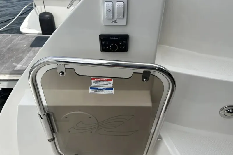 Logan Yacht Photos Pics 2018 Sea Ray Sundancer 400 boat door with control panel and safety notices.