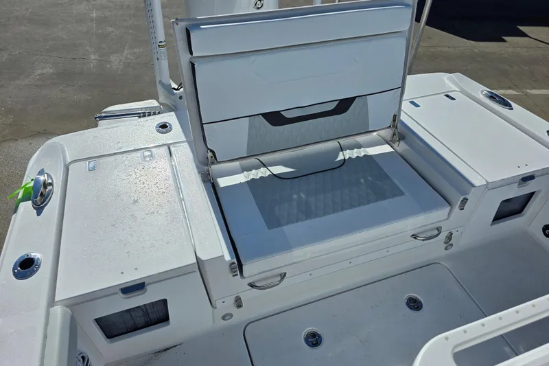  Yacht Photos Pics 2026 Blackfin 262 HB boat seating area with storage compartments and cup holders.