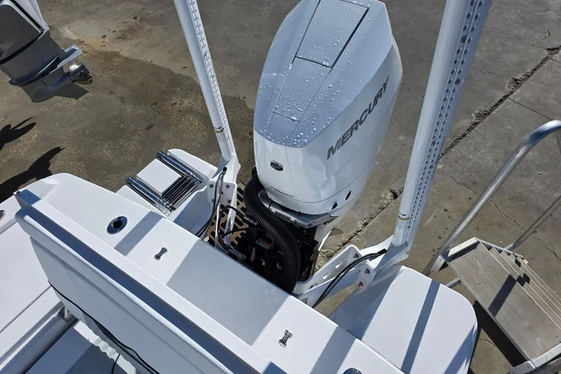  Yacht Photos Pics 2026 Blackfin 262 HB boat with Mercury outboard engine, docked on concrete surface.