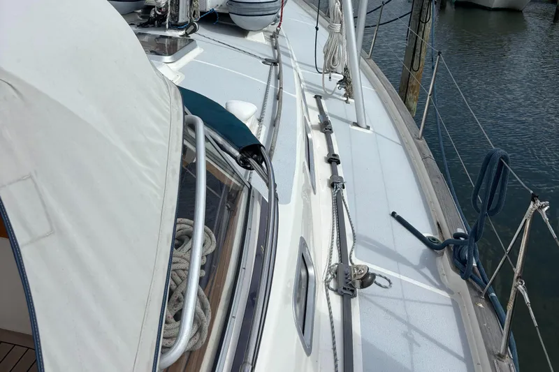 Cygnus Yacht Photos Pics Deck view of a 2000 Hallberg-Rassy 46 sailboat, featuring rigging and ropes.