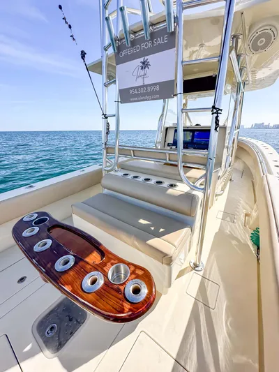 Full Attention Yacht Photos Pics 2012 Contender 39 ST boat for sale, ocean view, luxury seating, and fishing rod holders.