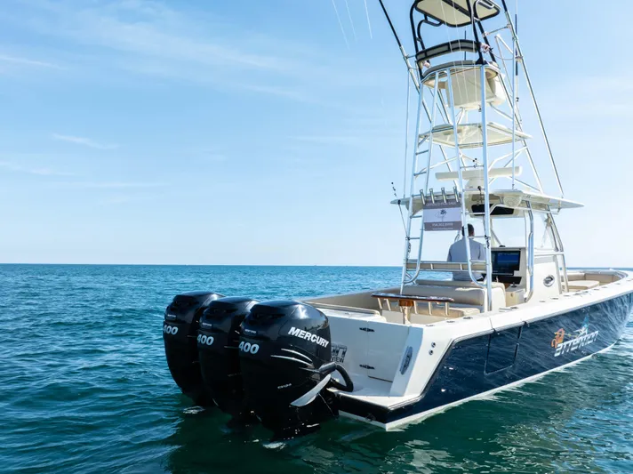 Full Attention Yacht Photos Pics 2012 Contender 39 ST boat with triple Mercury engines on open sea.