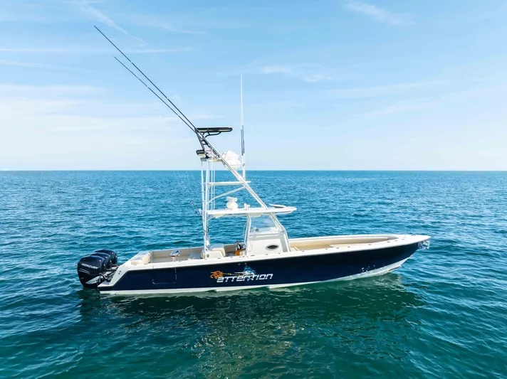 Full Attention Yacht Photos Pics 2012 Contender 39 ST boat on open sea under clear blue sky.