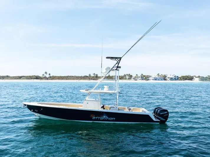 Full Attention Yacht Photos Pics 2012 Contender 39 ST boat on calm ocean near shoreline.