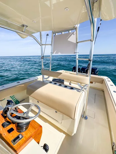 Full Attention Yacht Photos Pics 2012 Contender 39 ST boat interior with ocean view, featuring helm and seating area.
