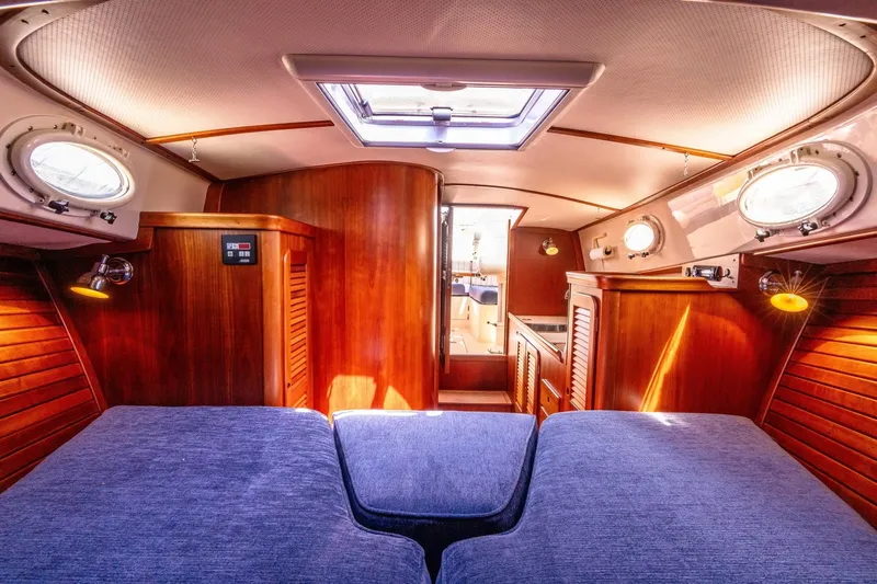Old Fashioned Yacht Photos Pics Luxurious 2002 Hinckley Picnic Boat EP interior with wood paneling and cozy seating.